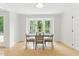 Dining area with view through large windows and hardwood floors at 101 Easton Ct, Garner, NC 27529