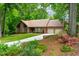 Attractive brick home boasting a long driveway, lush landscaping, and blooming azaleas, creating a welcoming entrance at 101 Easton Ct, Garner, NC 27529