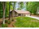 Charming brick home with lush green lawn, mature trees, and a two car garage, offering classic curb appeal at 101 Easton Ct, Garner, NC 27529