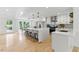 Bright, open kitchen featuring a large island, stainless steel appliances, and seamless access to the dining area at 101 Easton Ct, Garner, NC 27529
