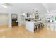 Bright open kitchen with a large island, light cabinets and hardwood floors at 101 Easton Ct, Garner, NC 27529