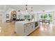 Kitchen island featuring white cabinetry, stainless steel appliances, and hardwood floors at 101 Easton Ct, Garner, NC 27529