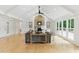 Open living room with a fireplace, high ceilings, and hardwood floors at 101 Easton Ct, Garner, NC 27529