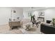 Open living area with wood-look floors, neutral paint, modern furniture, and lots of natural light at 101 Easton Ct, Garner, NC 27529