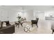 Open living area with wood-look floors, neutral paint, modern furniture, and a view to the kitchenette at 101 Easton Ct, Garner, NC 27529