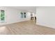 Spacious living area with wood-look floors, neutral paint, and a door to the outside at 101 Easton Ct, Garner, NC 27529