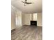 Bright living room with wood laminate flooring and a cozy fireplace at 101 Woodbridge Ln, Chapel Hill, NC 27514