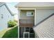 A second story balcony with wood trim overlooks the screened-in porch, offering a view of the backyard at 1013 Oatney Ridge Ln, Morrisville, NC 27560