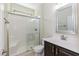 Updated bathroom with shower, vanity, and white tile at 1013 Oatney Ridge Ln, Morrisville, NC 27560