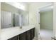 Bathroom with a modern vanity, a large mirror, white counter tops and neutral walls at 1013 Oatney Ridge Ln, Morrisville, NC 27560