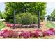 Community entrance with manicured landscaping and decorative signage at 1013 Oatney Ridge Ln, Morrisville, NC 27560