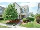 Charming two-story home with a well-manicured lawn and inviting front porch at 1013 Oatney Ridge Ln, Morrisville, NC 27560