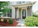 Covered front porch with decorative details and landscaping at 1013 Oatney Ridge Ln, Morrisville, NC 27560