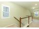Upstairs hallway with natural lighting from a window at 1013 Oatney Ridge Ln, Morrisville, NC 27560