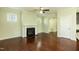 Open living room design features hardwood floors, a fireplace, and an arched doorway at 1013 Oatney Ridge Ln, Morrisville, NC 27560