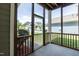 Screened porch showcasing backyard view, wooden supports, and concrete floor at 1013 Oatney Ridge Ln, Morrisville, NC 27560