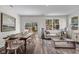 Open dining area with a large table set for meals, blending seamlessly with the living space at 106 S Chubb Rdg, Wilson's Mills, NC 27520