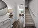 Welcoming foyer with hard surface floors, stairs to the second floor, and views into the living spaces at 106 S Chubb Rdg, Wilson's Mills, NC 27520
