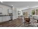 Open-concept living space with hard surface flooring, modern lighting, and backyard access at 106 S Chubb Rdg, Wilson's Mills, NC 27520