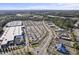 Expansive aerial view showcasing retail area, ample parking, and surrounding green spaces at 1073 Branch Line Ln, Apex, NC 27502