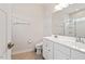 Bright bathroom featuring double vanity and shower with glass door at 1073 Branch Line Ln, Apex, NC 27502