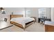 Neutral-toned primary bedroom features a piano, natural light, and minimal decor at 1073 Branch Line Ln, Apex, NC 27502