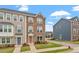 Charming townhomes with brick facades, well-maintained landscaping, and street view at 1073 Branch Line Ln, Apex, NC 27502