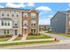 Beautiful townhomes with brick and siding, well-maintained landscaping, and street access at 1073 Branch Line Ln, Apex, NC 27502