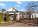 Beautiful community clubhouse exterior view with brick facade, white trim, and landscaped grounds at 1073 Branch Line Ln, Apex, NC 27502