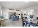 Open concept kitchen with stainless appliances, an island, and an adjacent dining area at 1073 Branch Line Ln, Apex, NC 27502
