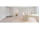 Bright staged office space with a desk, chair, and shelving, plus two entry doors at 1073 Branch Line Ln, Apex, NC 27502