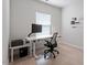 Modern office space with a large desk, chair, and natural light at 1073 Branch Line Ln, Apex, NC 27502