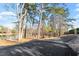 Picturesque community view of the pond surrounded by mature trees at 1073 Branch Line Ln, Apex, NC 27502