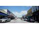 Inviting street view featuring a variety of storefronts with awnings under a clear blue sky at 1073 Branch Line Ln, Apex, NC 27502