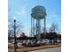 A view of the Apex water tower with cars and landscaping in the surrounding area at 1073 Branch Line Ln, Apex, NC 27502