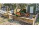 Cozy brick patio with wooden furniture, perfect for outdoor relaxation and entertaining at 1112 Western Ave, Rocky Mount, NC 27804