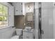 The bathroom features a modern toilet and vanity, plus a bright-white shower at 1112 Western Ave, Rocky Mount, NC 27804
