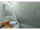 This farmhouse-style bathroom features a corrugated metal sink at 1112 Western Ave, Rocky Mount, NC 27804