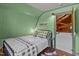 Cozy bedroom with rustic decor and natural light at 1112 Western Ave, Rocky Mount, NC 27804