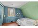 This bright bedroom features built-ins and charming cottage decor at 1112 Western Ave, Rocky Mount, NC 27804
