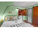 Charming bedroom with rustic decor and a barn door closet at 1112 Western Ave, Rocky Mount, NC 27804