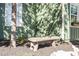Stone bench in front of the home with a white trim window with flowers at 1112 Western Ave, Rocky Mount, NC 27804