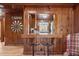Charming kitchen bar area with rustic wood paneling and a view into the kitchen at 1112 Western Ave, Rocky Mount, NC 27804