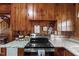 Close-up of the kitchen features wooden cabinets, granite countertops, and modern appliances at 1112 Western Ave, Rocky Mount, NC 27804