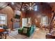 Cozy living area with wood-paneled walls, fireplace, TV, and an open layout with comfortable seating at 1112 Western Ave, Rocky Mount, NC 27804
