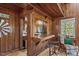 Cozy living space with a wooden bar, window, and an armchair in a rustic home at 1112 Western Ave, Rocky Mount, NC 27804