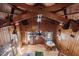 Unique living space with high beamed ceilings, a dining area, and cozy furnishings at 1112 Western Ave, Rocky Mount, NC 27804