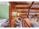 View of the loft shows the knotty pine paneled walls and beamed ceiling at 1112 Western Ave, Rocky Mount, NC 27804