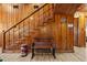 Classic wooden staircase with a decorative bench and vintage accents adding to its charm at 1112 Western Ave, Rocky Mount, NC 27804