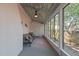 Bright sunroom with white brick accents, a metal ceiling, large windows, and comfortable seating at 1112 Western Ave, Rocky Mount, NC 27804